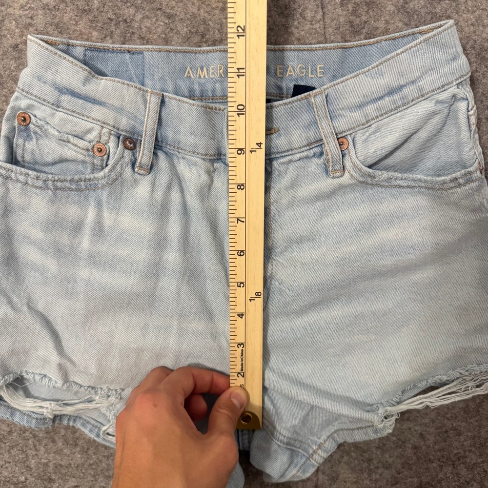 American Eagle Strigid Light Wash Mid Waisted Distressed Denim Shorts Size 00 - Picture 9 of 9